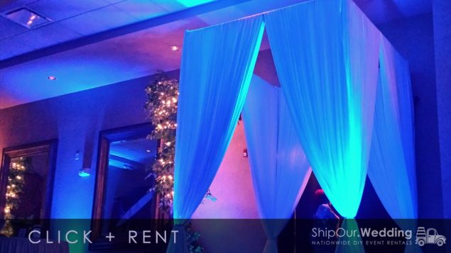 blue_uplights_on_draped_entrance